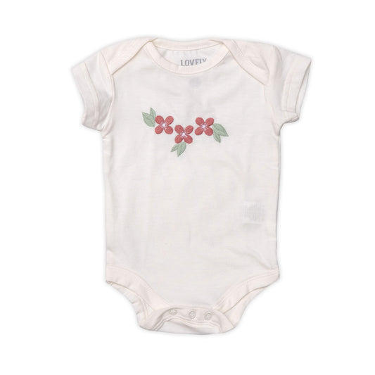 Girls' summer jumpsuit in white with floral prints.