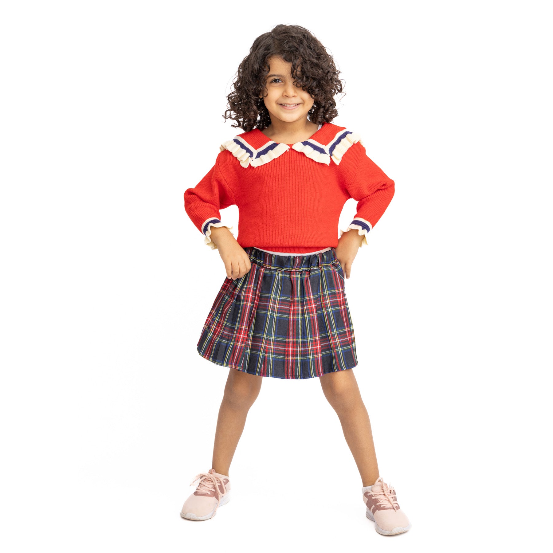 set of red shirt with decorations and a stripped skirt