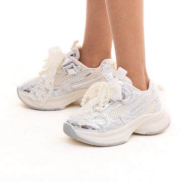 Girls' white sneakers with a charm strap