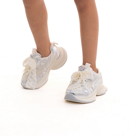 Girls' white sneakers with a charm strap