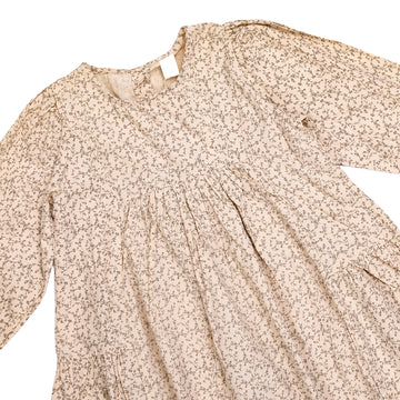 Girls' dress in beige with a floral print