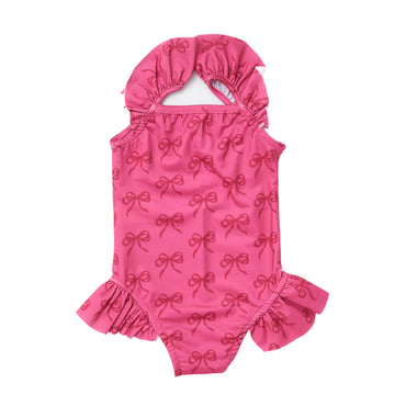 Girls' fuchsia swimsuit with bows