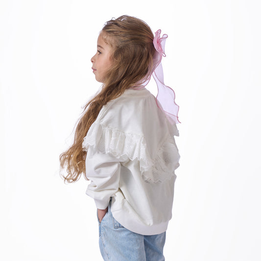 girls' blouse with ruffles on the chest