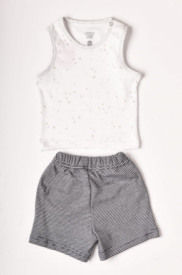 white with print sleeveless shirt and dark blue shorts