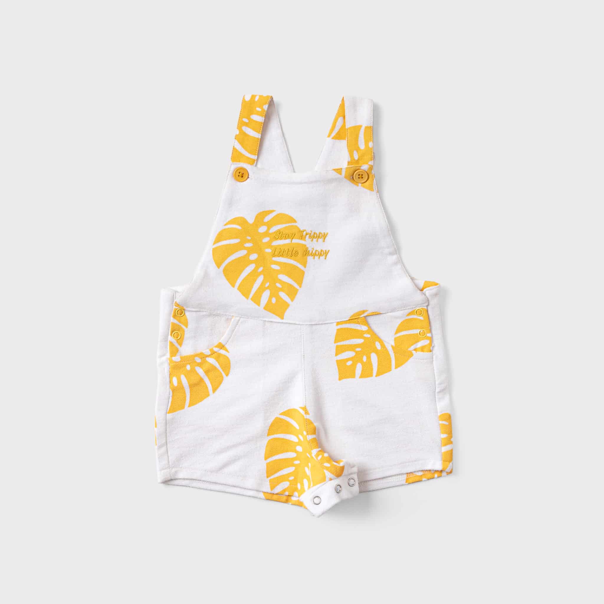 yellow leaves printed over white baby boy jumpsuit