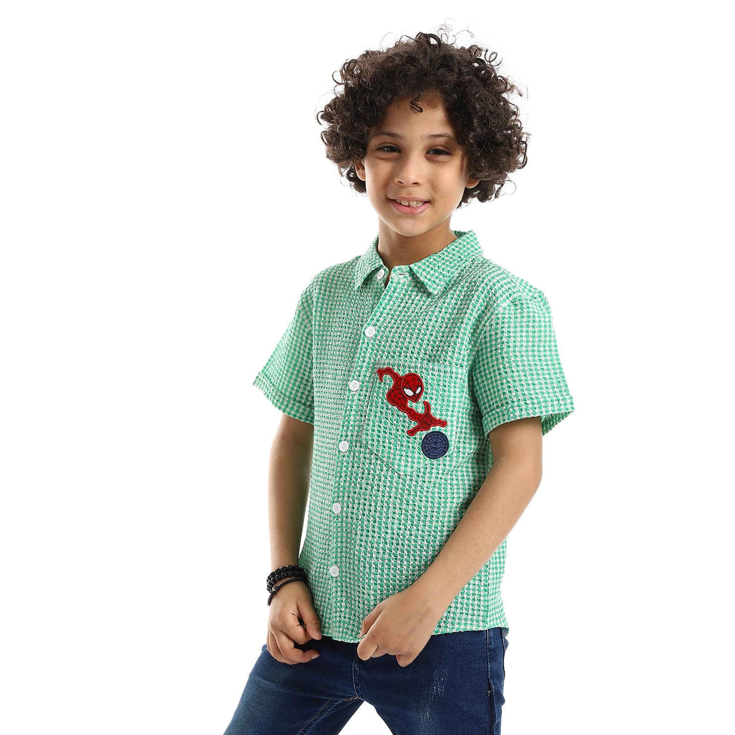 black spiderman logo stitched patch over green white boys shirt 1